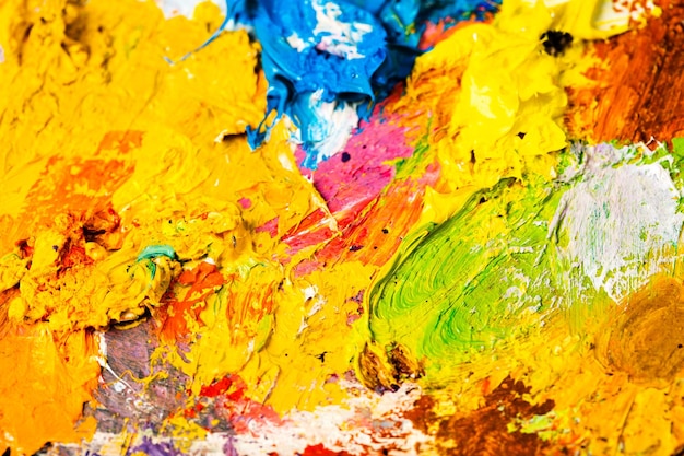 Background image of bright oilpaint palette closeup