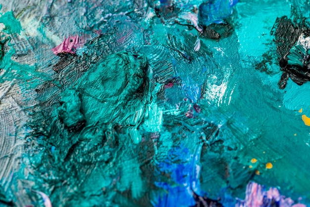 Background image of bright oilpaint palette closeup