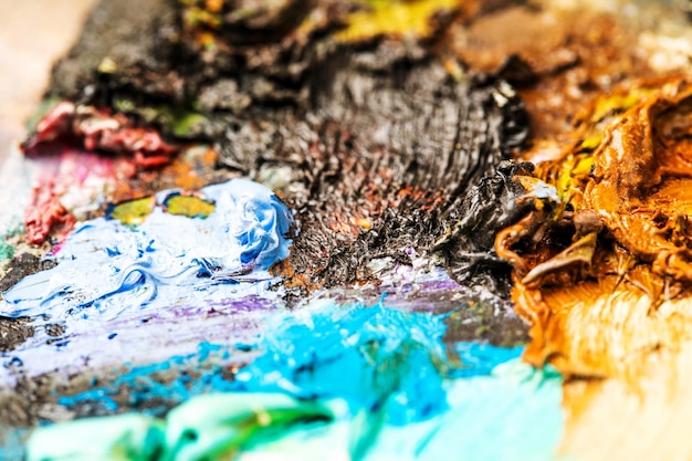 Background image of bright oilpaint palette closeup