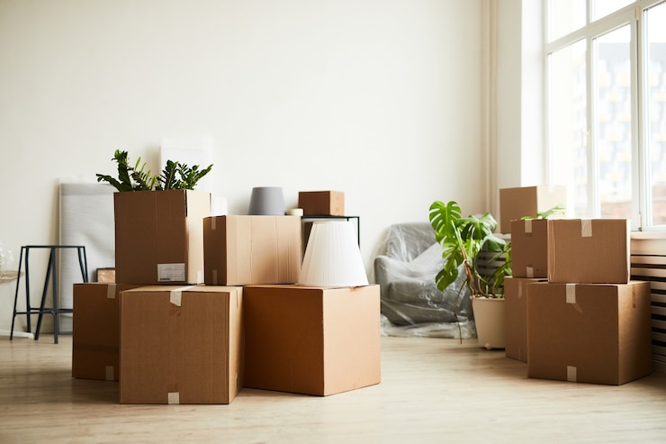 Photo background image of cardboard boxes in empty room moving to new home concept copy space