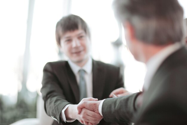 Background image closeup of handshake of business partners