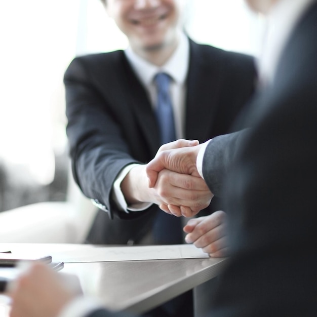 Background image closeup of handshake of business partners