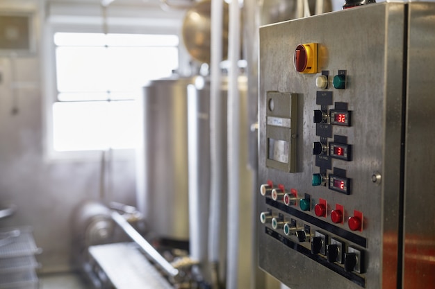 Background image of control panel with buttons and displays in workshop at production plant, copy space