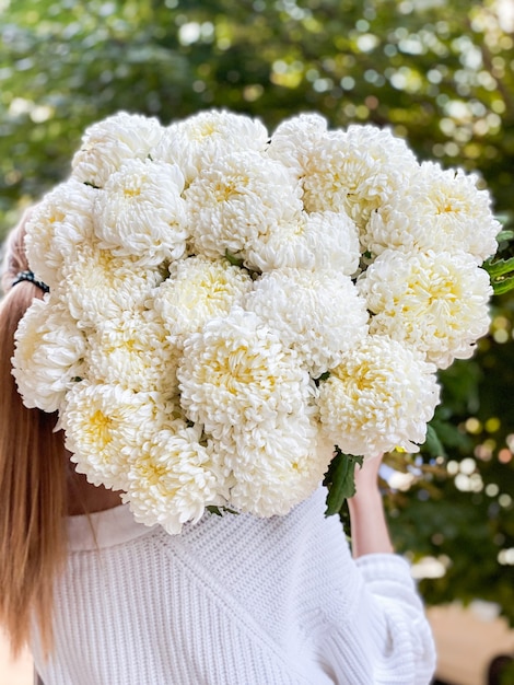 Background image of flowers in closeup A bouquet of white chrysanthemums of an unusual variety