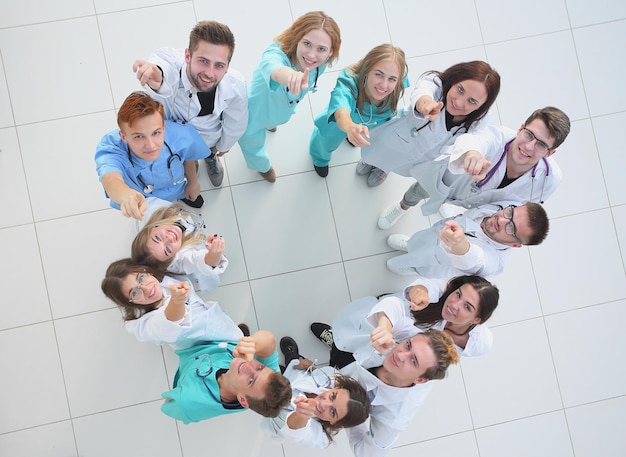 Background image of the head and a group of young doctors