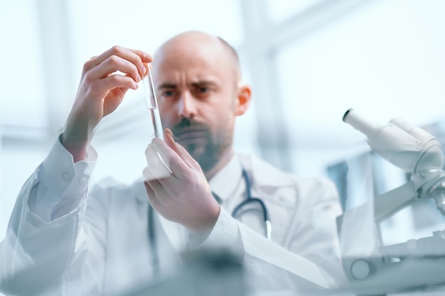 Background image of a researcher examining samples of a new vaccine