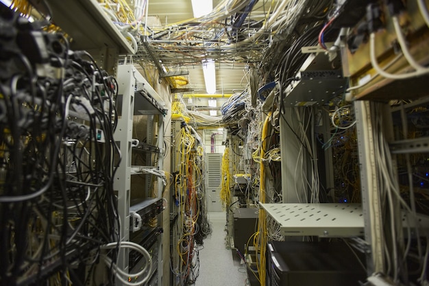 Background image of server room network with internet cables and wires in heaps, copy