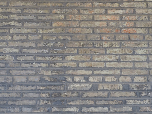 The background image of a wall made of gray brick blocks