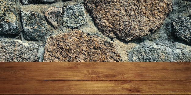 The background is blank wooden boards and a textured stone wall with lighting and vignetting