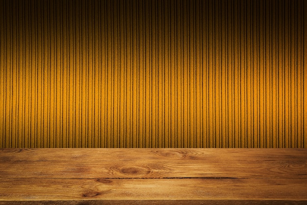 The background is blank wooden boards and a textured striped wall with gradient lighting