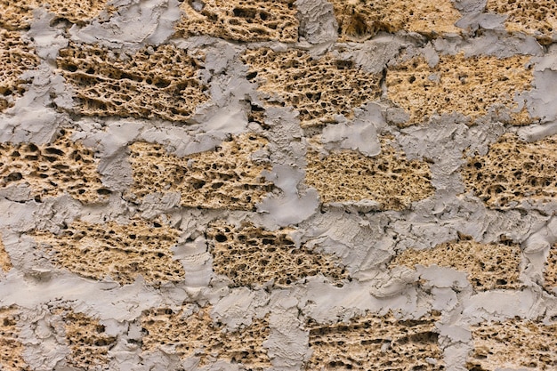 The background is made of beige stone decorative brick porous
texture