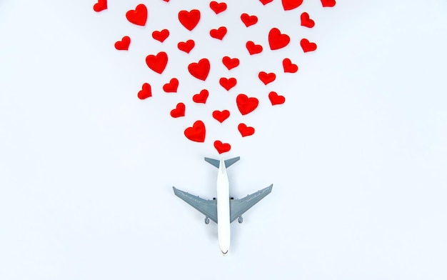 Background isolate with hearts and airplane. Valentine's Day. Selective focus. Valentine.
