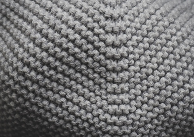 Фон вязаный свитер крупным планом. Текстура трикотажа.