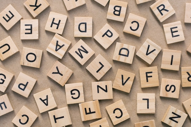 background of  letterpress wood type printing blocks, random letters of alphabet