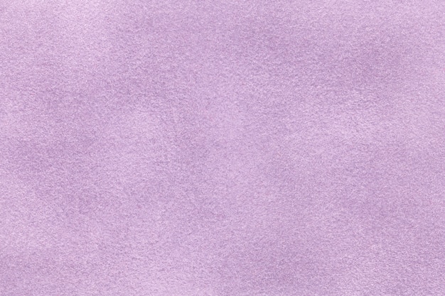 Background of light violet suede fabric closeup. 