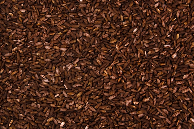 Background long brown rice closeup