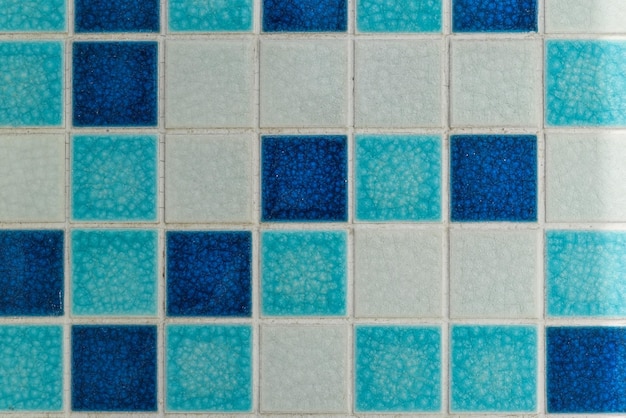 Background made of square small blue and white mosaic with copy space