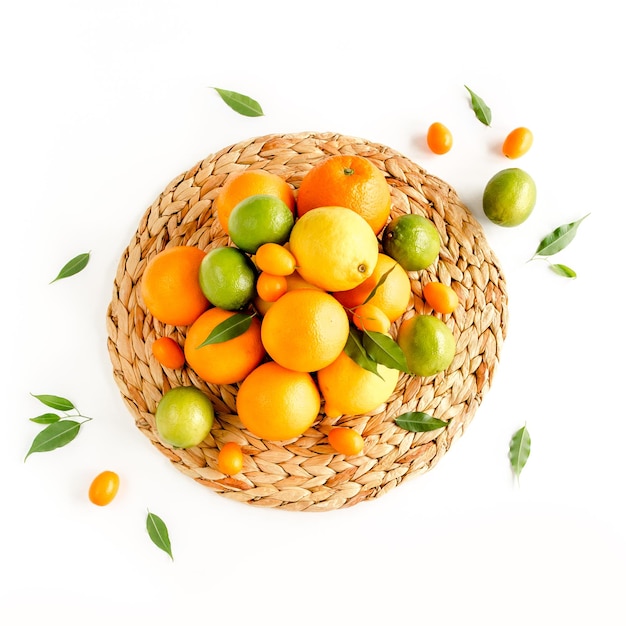 Background made of summer tropical fruits orange lemon lime on white background food concept flat la