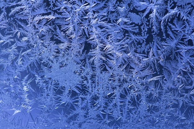 Photo background made of winter frozen window glass