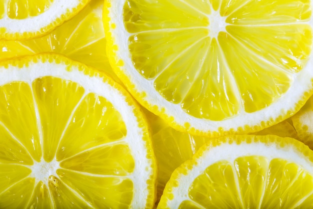 Background made with a heap of sliced lemons