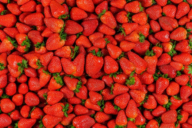 Background of many pieces of strawberries