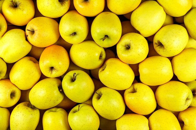 Background of many yellow apple pieces