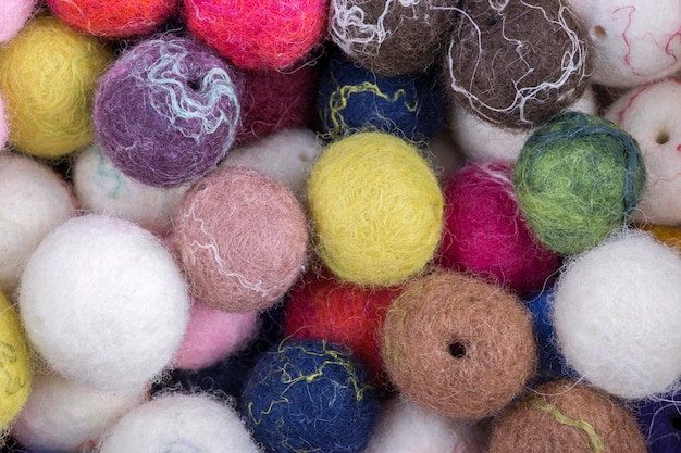 Background of multicolored balls of wool felted