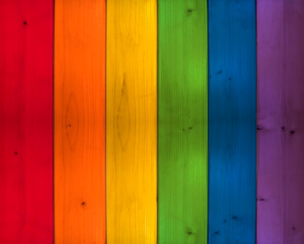 Background of multicolored boards in the colors of the rainbow Wooden texture Colorful drawing Mo