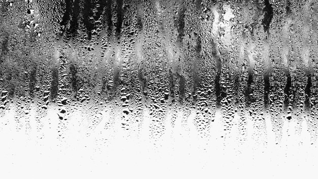 Background of natural condensation of water on transparent glass with high air humidity, large drops dripping