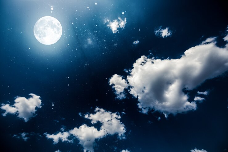 星と月との背景の夜空。