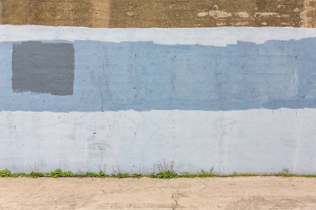 Background of old gray painted wall. Aged street wall background, texture.