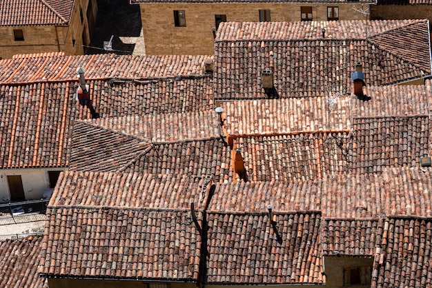 background of old village houses with stone walls and red tile roofs frias burgos