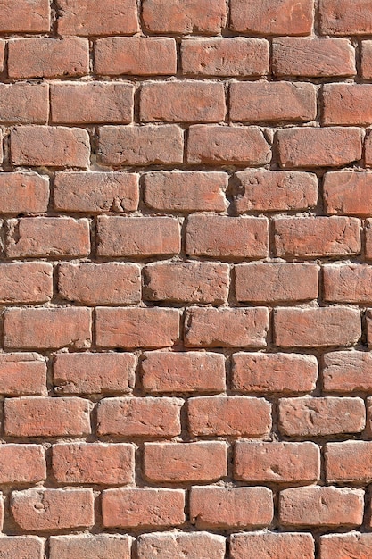 Background of old vintage brick wall texture close up