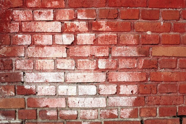 Background, old wall of red brick with a white spot. Place for text