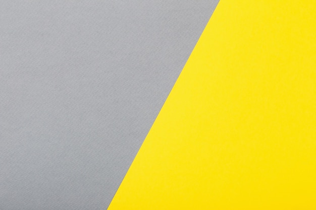トレンディな黄色と灰色の紙の背景