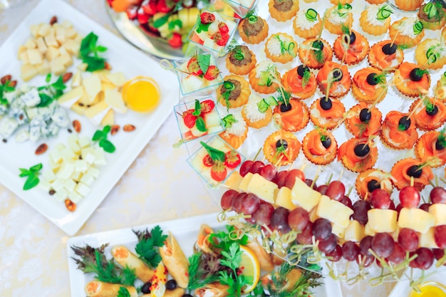 Background of party appetizers on wooden sticks