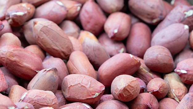 Background of peanut placer bright snacks; close-up