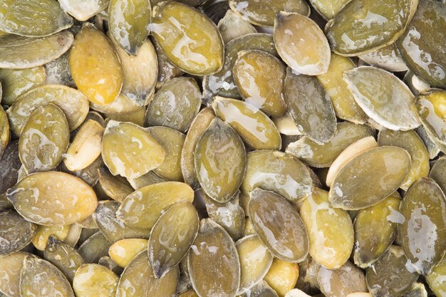 Background of peeled pumpkin seeds