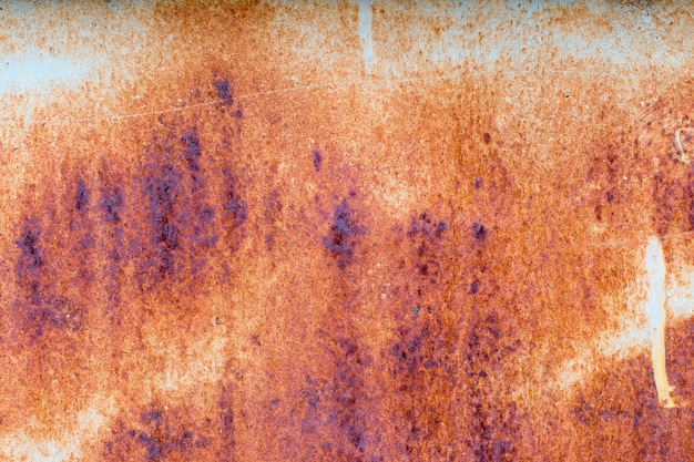 A background of peeling paint and rusty old metal