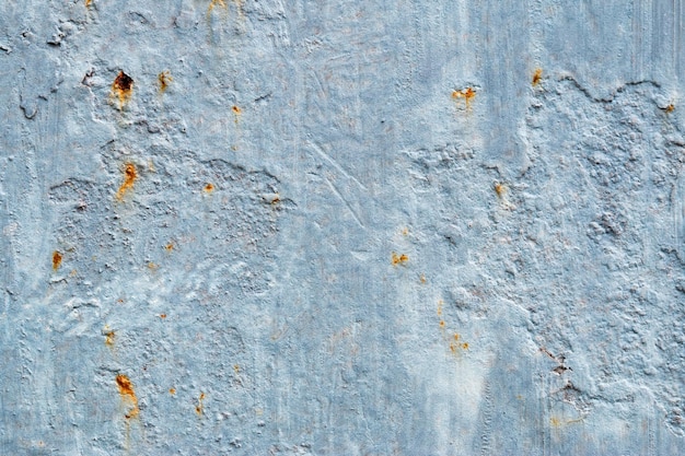 A background of peeling paint and rusty old metal