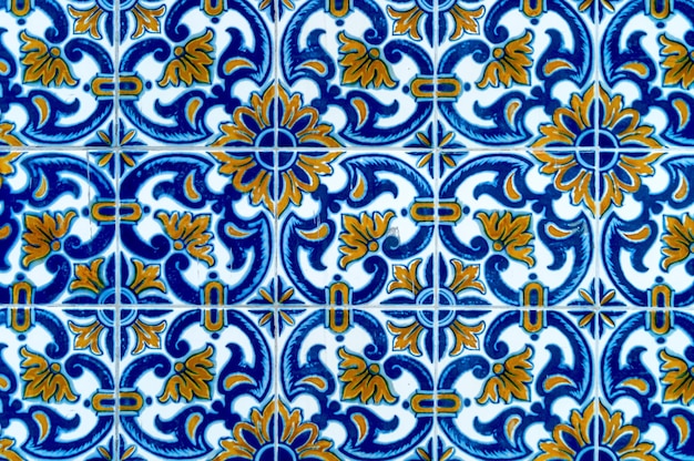 Background photograph of antique Portuguese tile pattern in blue and yellow color