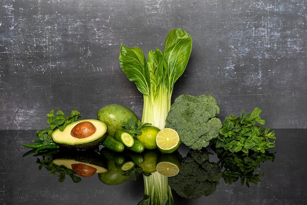 Background photography of green vegetables broccoli lime mint cucumbers avocado