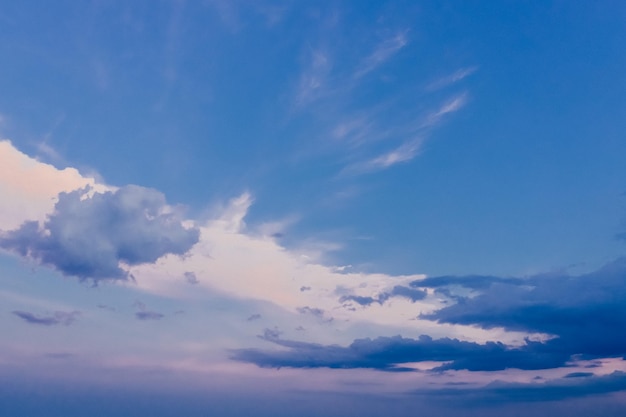 Background of picturesque light and dark clouds in the evening sky