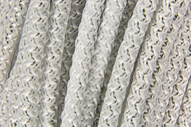 Background of a piece of white braided rope