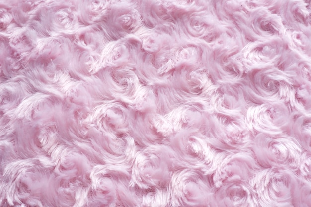 background of pink faux fur with curls.