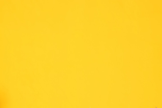 A background of a plain yellow wall