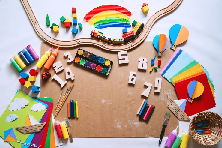 Background for preschool or kindergarten or art classes Kids educational toys and school supplies for draw and make DIY crafts Flat lay top view Art child frame with empty paper mock up for text