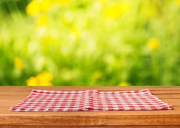 Background for product montage with tablecloth on wooden table