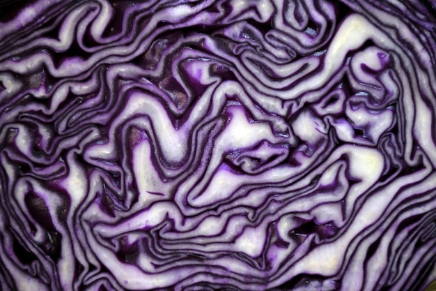 Background of purple cabbage in a section closeup for the whole frame