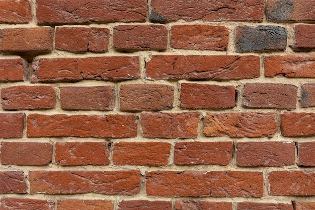 Background of a red brick wall Closeup